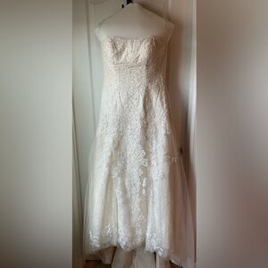 Strapless Ivory wedding dress. Size 8-10. Worn once for photos only.